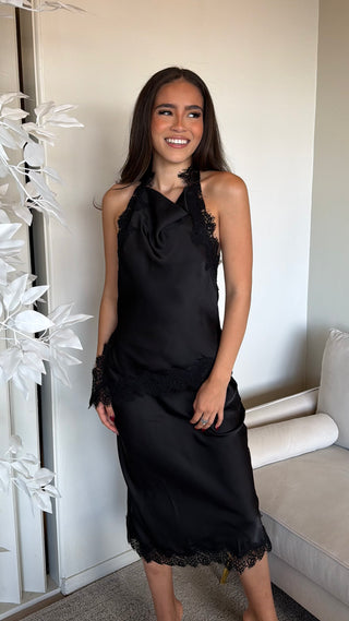 A black midi skirt with lace accents, featuring a regular fit and pull-on style.