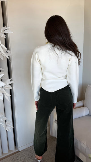 ASYMETRICAL HEM WITH EMBELLISHED NECKLINE SWEATER