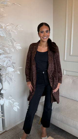 Brown animal print coat with a relaxed fit and open front, worn by a model.