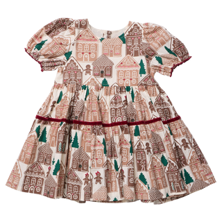 Eliza dress with gingerbread house pattern, featuring short puff sleeves and a full skirt.