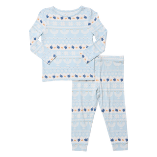 Light blue kids' pajama set with Hanukkah Fair Isle pattern, featuring menorahs and dreidels.