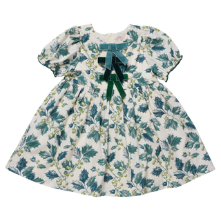 Girls' dress with green holly print and bow detail on 100% cotton fabric.