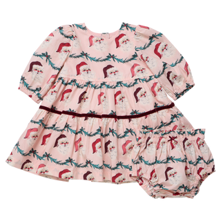 A baby girls' dress set featuring a Santa Garland print, with matching bloomers, made from 100% cotton.